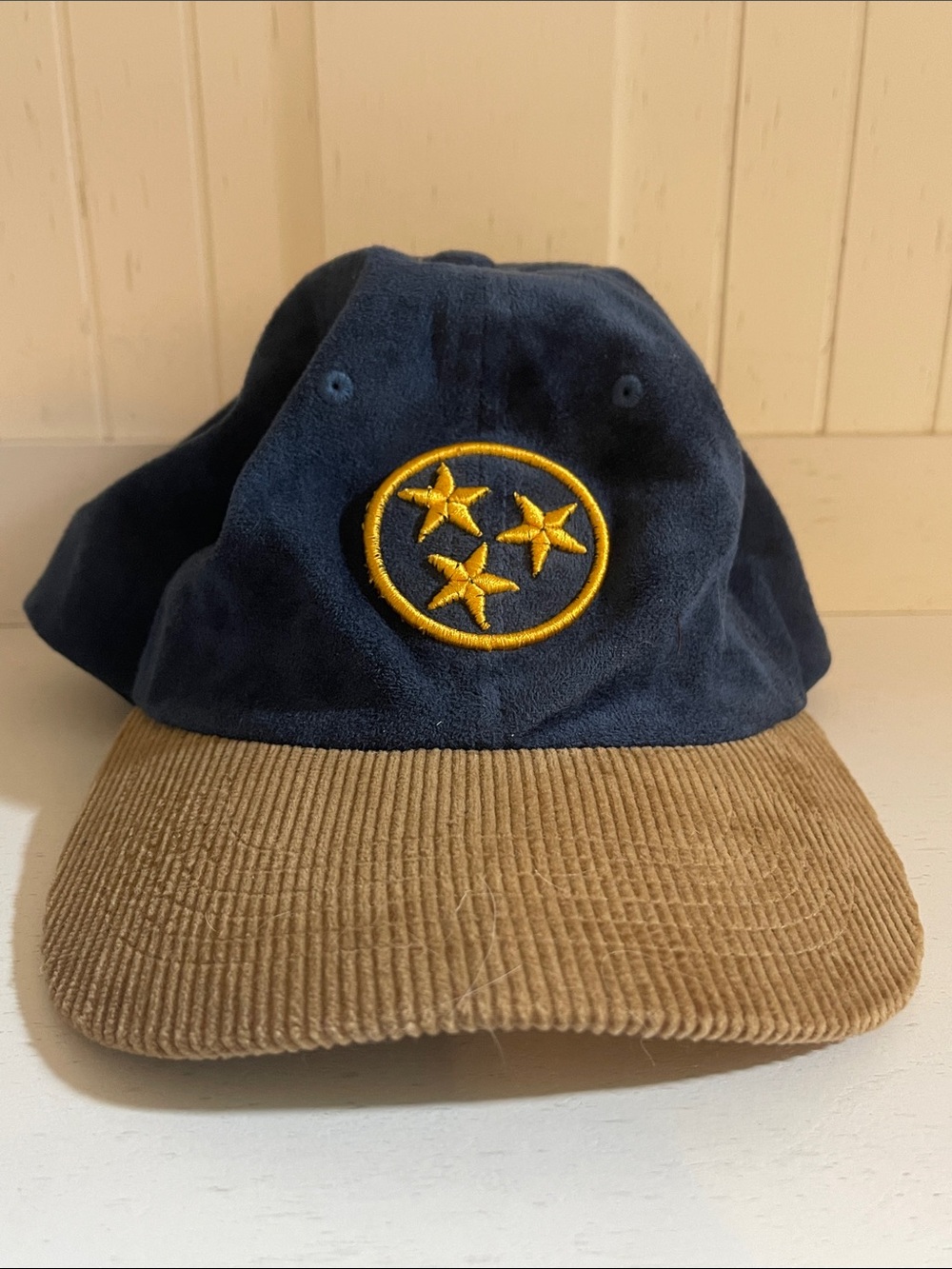 Navy & Tan Corduroy Brim Baseball Cap with Yellow Star Emblem